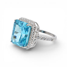 Halo Aquamarine Coloured Emerald Cut Ring