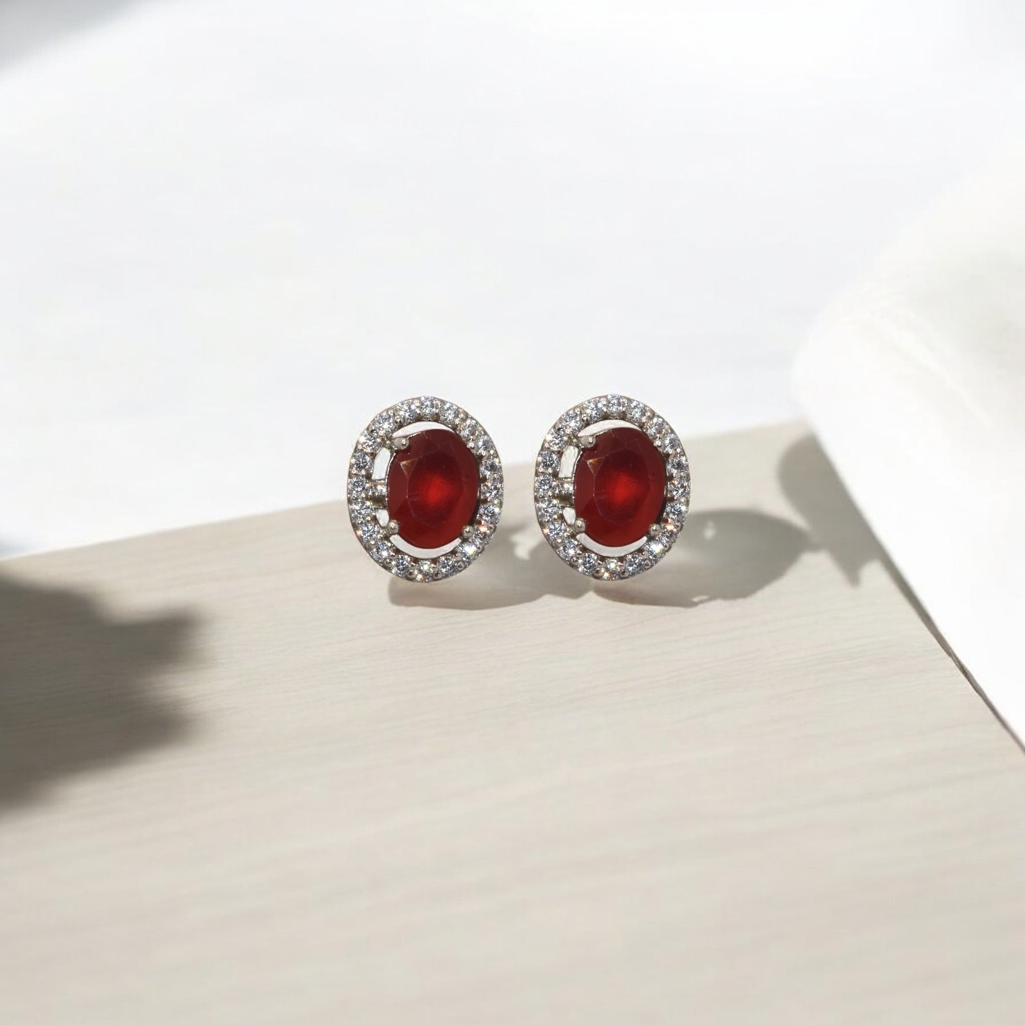 Halo Ruby Coloured Oval Shape Studs