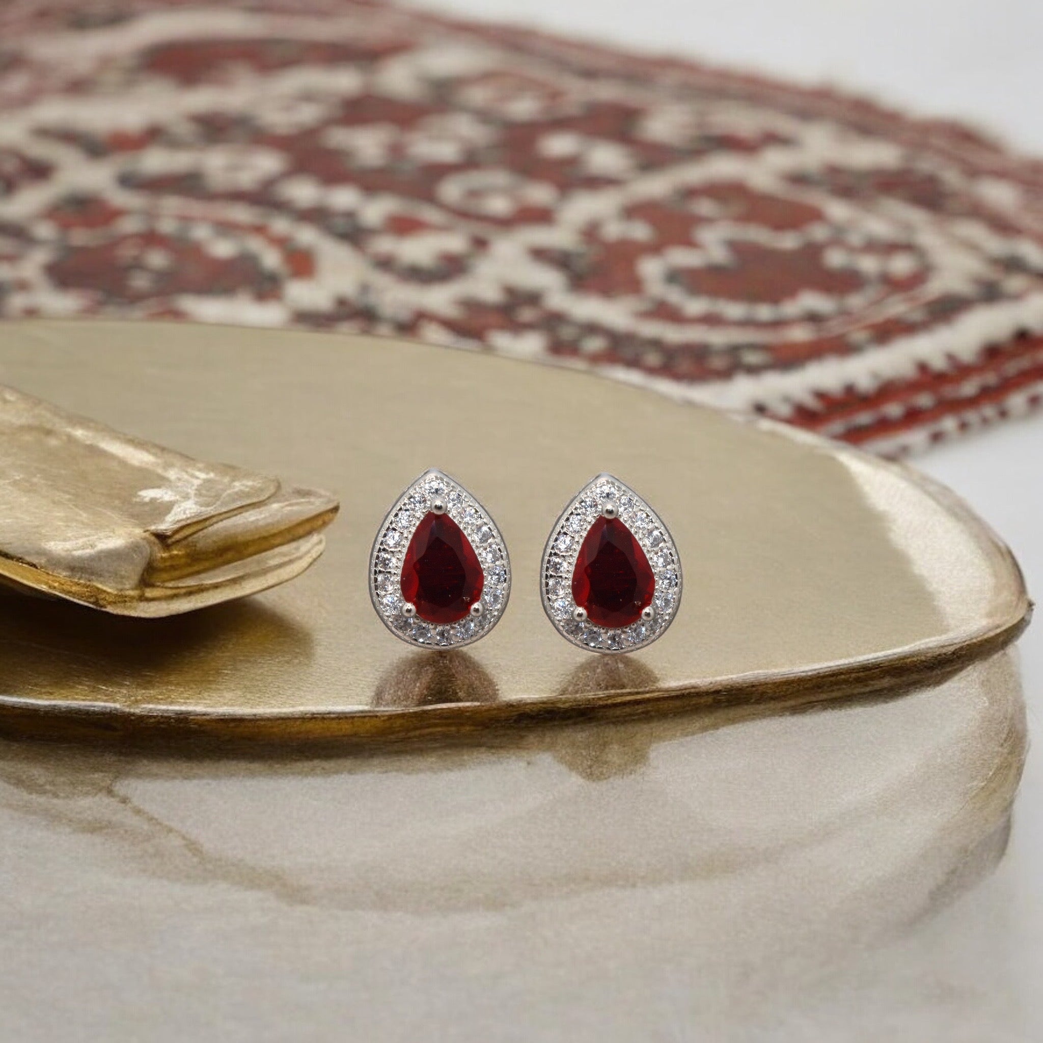 Halo Pear Shape Ruby Coloured Studs